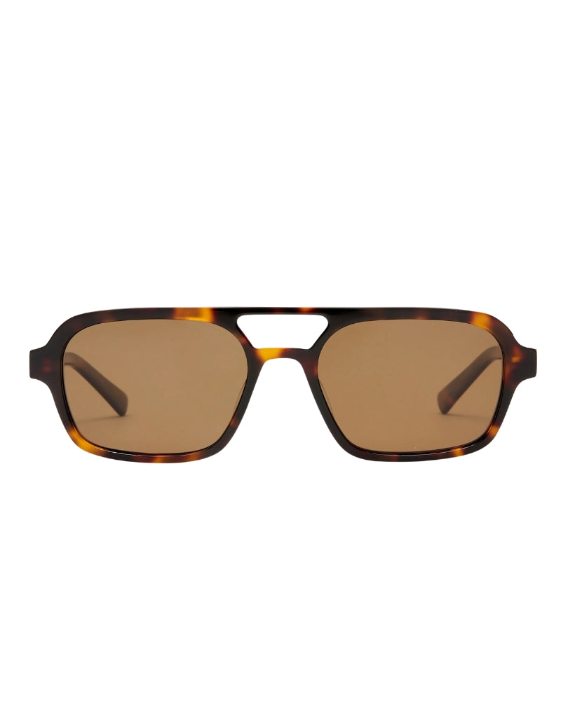 Sunglasses with tortoiseshell frame and brown lenses on a white background