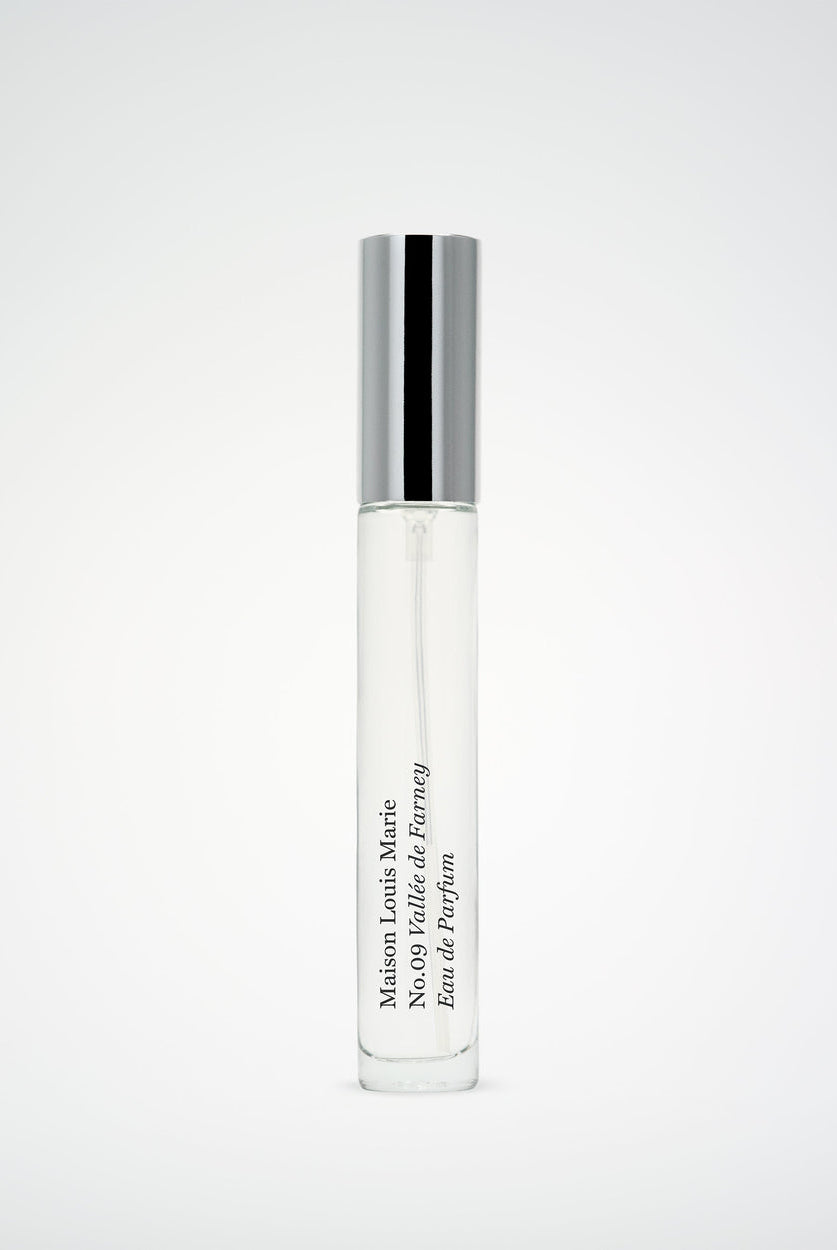 Perfume bottle with silver cap on a white background