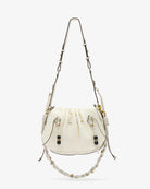 White handbag with drawstring and decorative elements on a white background