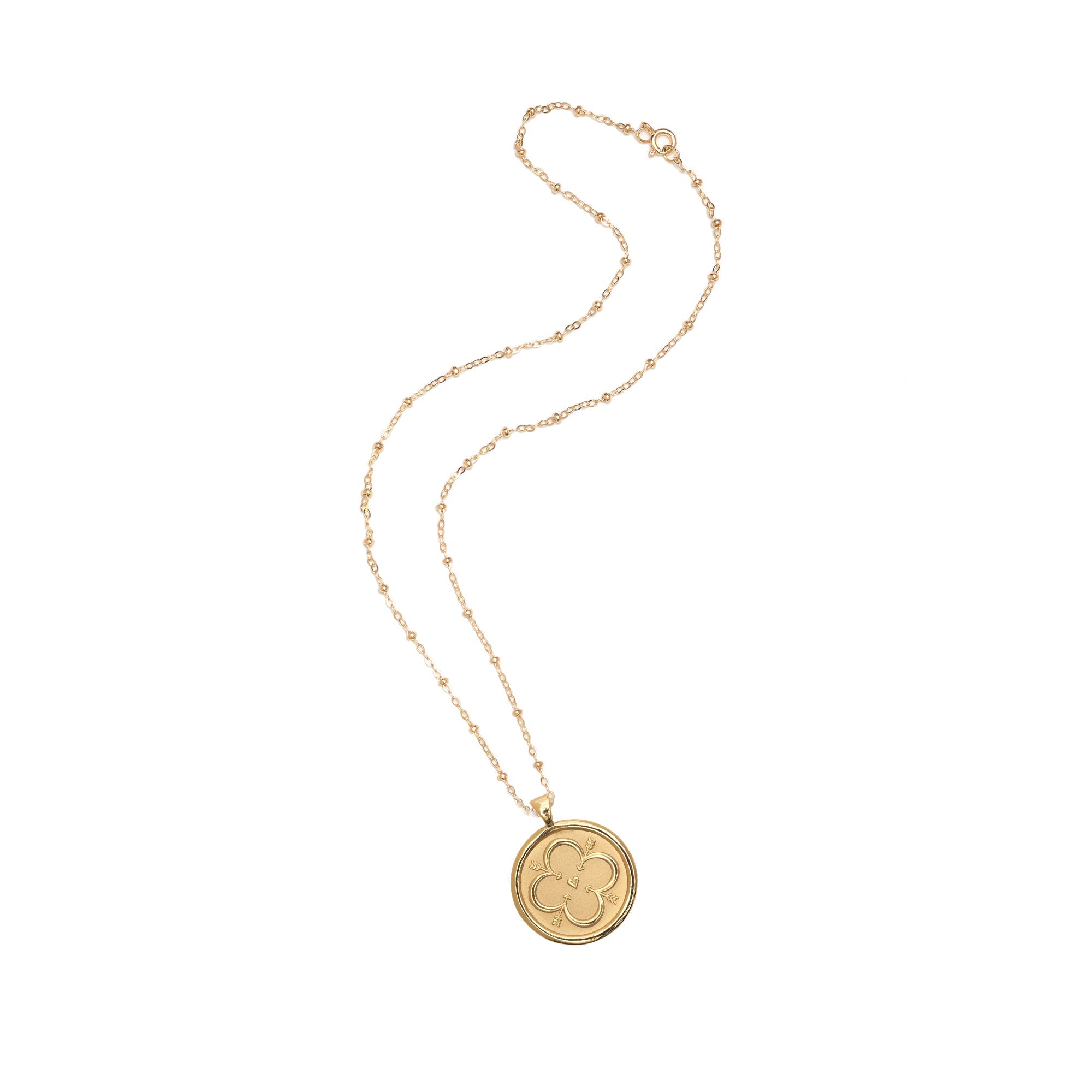 Gold necklace with a round pendant on a white background