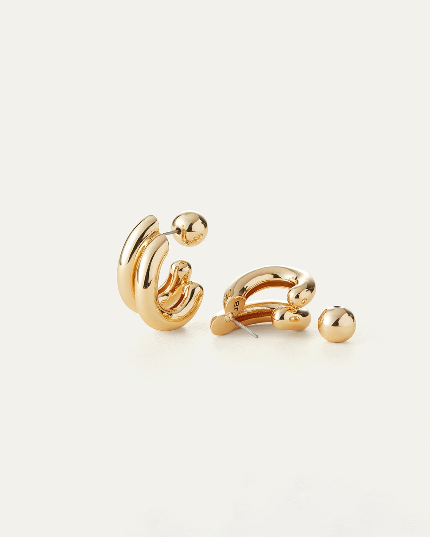 A pair of gold-tone plated brass earrings with a high polish finish. The earrings are designed with multiple loops and a ball backing.