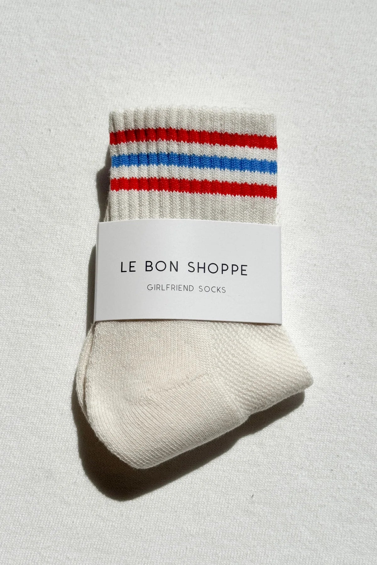 WHITE WITH RED AND BLUE STRIPE