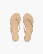 Pair of beige flip-flops on a white background