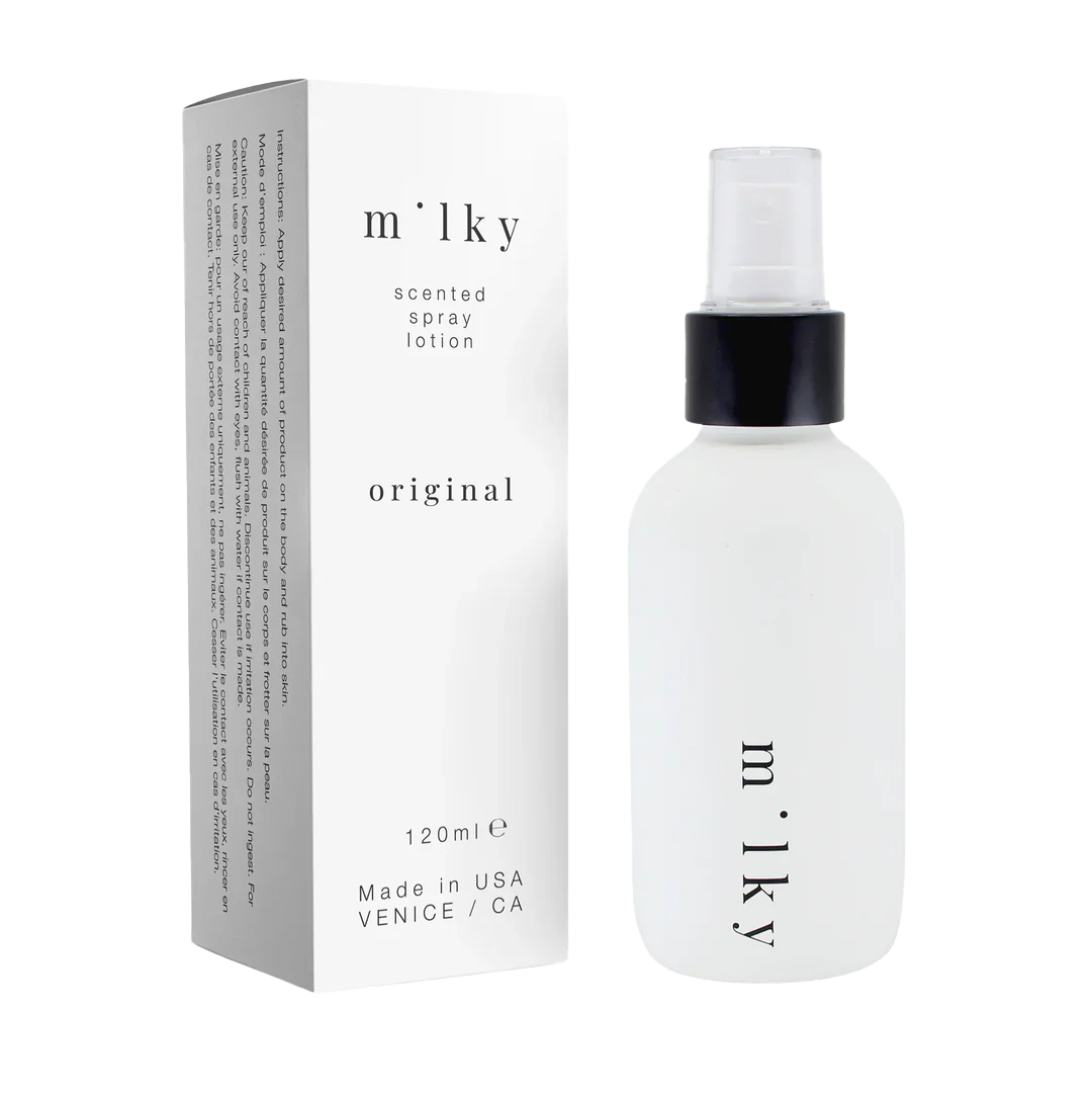 Milky scented spray lotion packaging and bottle on a white background