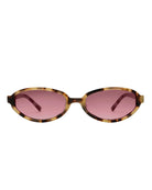 Sunglasses with tortoiseshell frame and pink lenses on a white background