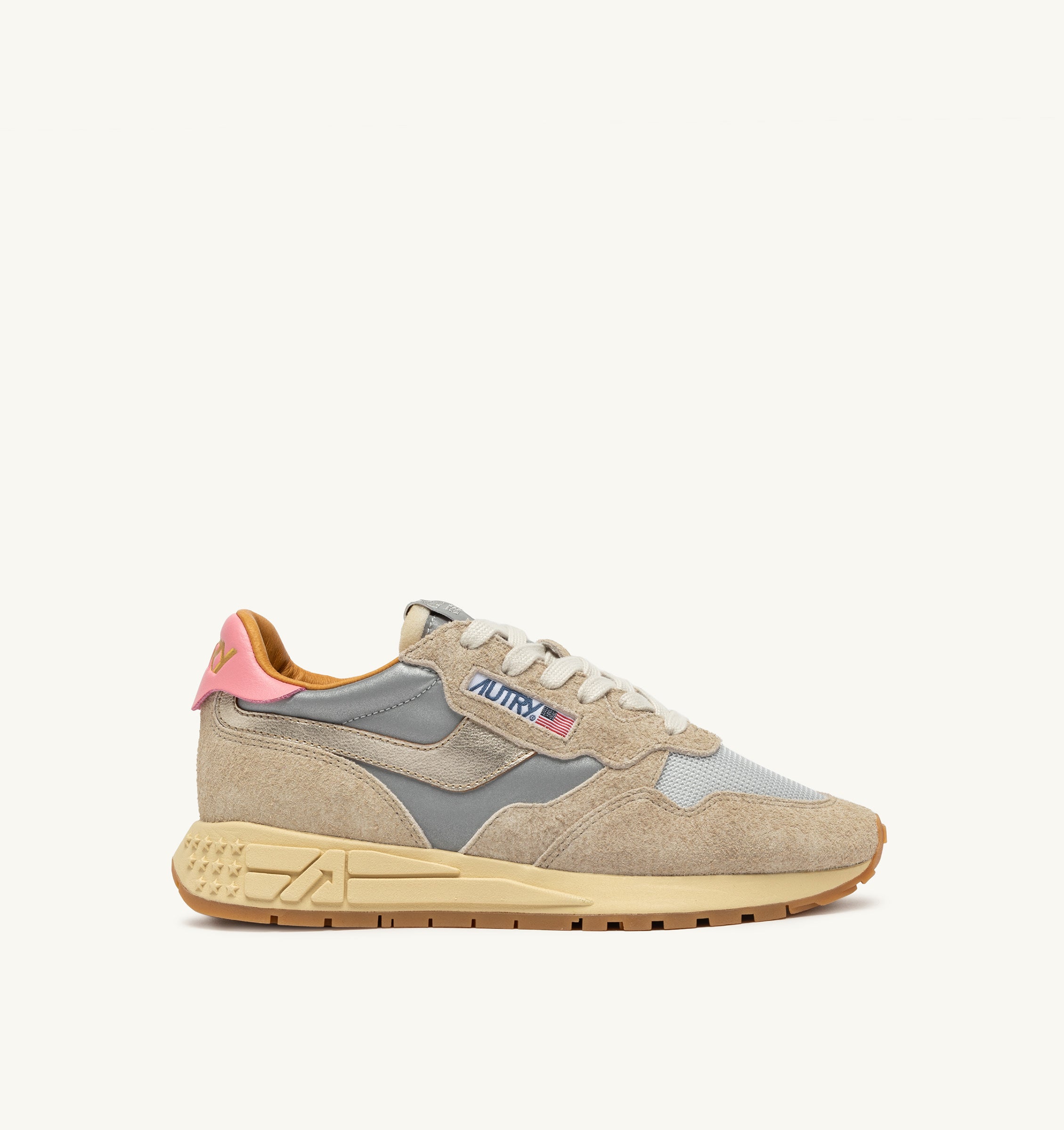 Beige sneaker with gray and pink accents on a white background