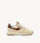 Beige sneaker with brown and blue accents on a white background