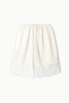White lace-trimmed skirt on a white background
