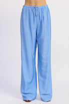 Light blue checkered pants on a white background