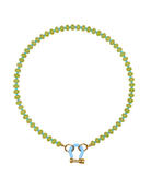 spicy dan Necklace with green beads and a gold clasp on a white background