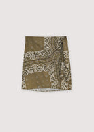 Olive green bandana with white patterns on a white background